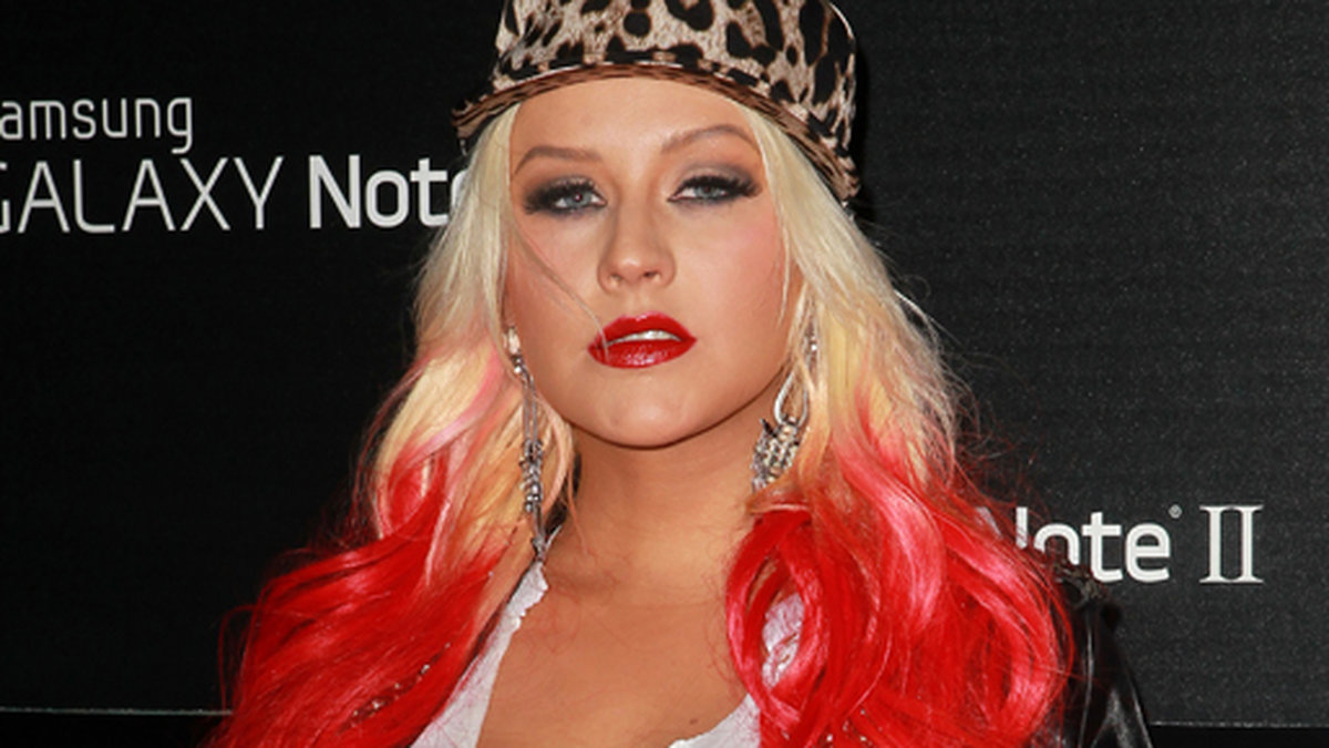 Vintern 2012 hånades Christina Aguilera för i stort sett allt. Tidningarna hackade på hennes vikt, hennes klädsel och sminkningar. Aguilera experimenterade vilt med färgade hårtoppar, tonårskläder och barnsliga mönster. 