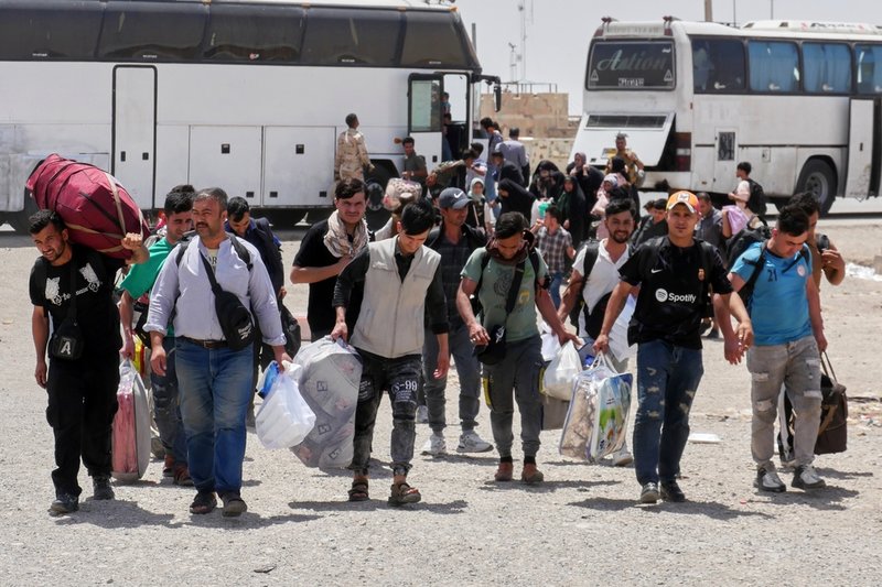 Afghaner som återvänder från Iran i juni, mitt under kriget mellan Iran och Israel. 