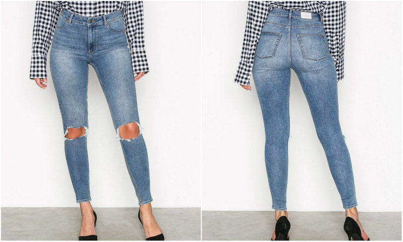 Höga tighta jeans knähål