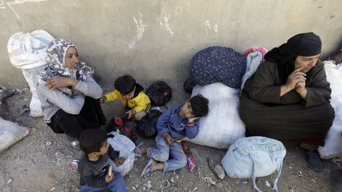 En syrisk familj i ett flyktingläger i Libanon, juni 2013. 
