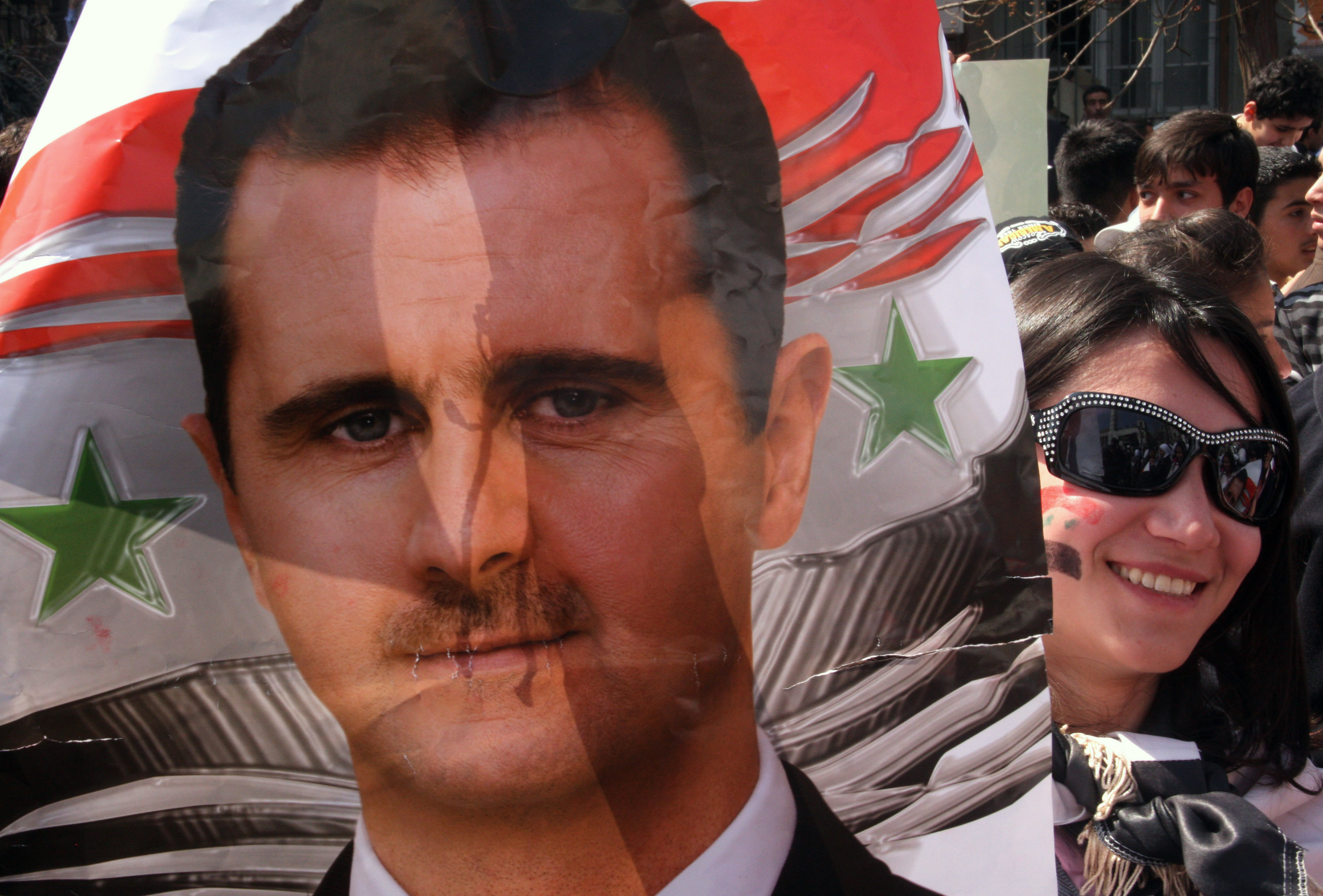 På affischen ses presidenten Bashar al-Assad. 