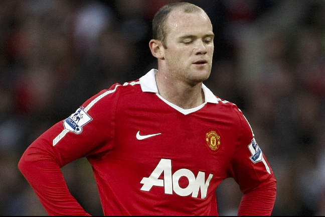 Wayne Rooney missar matchen mot Fulham.
