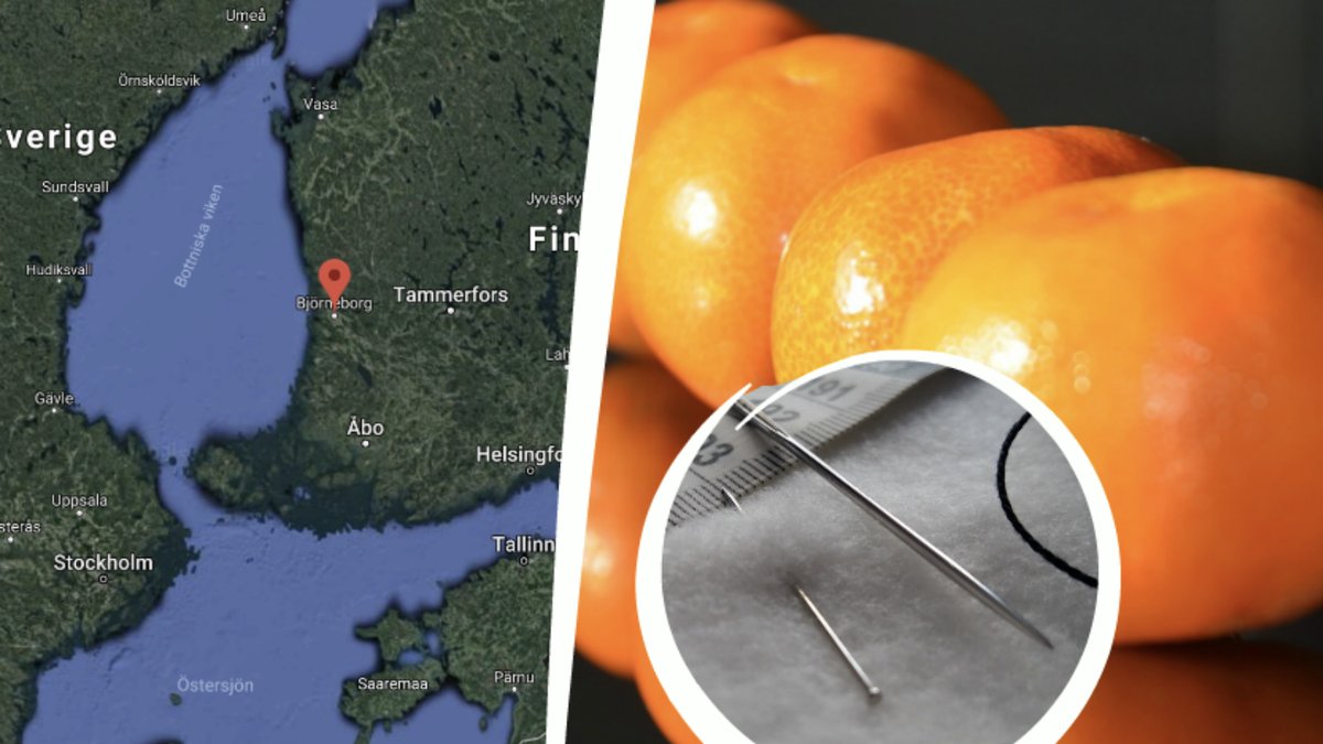 Karta över Finland. Synål och clementiner.
