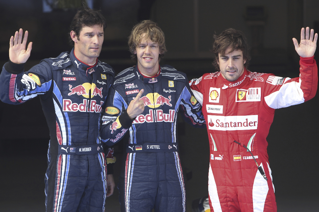 Stallkamraten Mark Webber (t.v.) slutade tvåa, medan Ferraris Fernando Alonso (t.h.) kom trea.